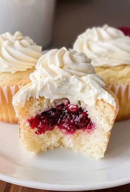 Almond Wedding Cake Cupcakes with Raspberry Filling